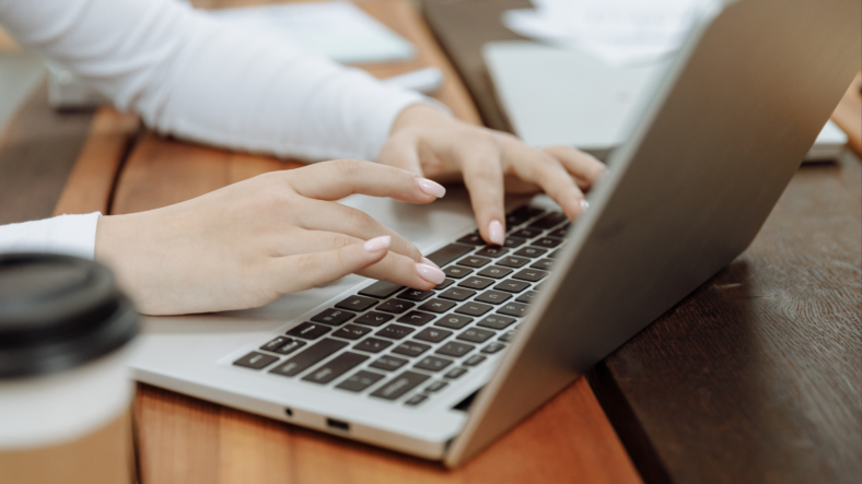 Female hands typing on Laptop - Ft Image or Unleash your business productivity with this simple tips - Blog Post